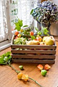 Apples, Pears and Physalis in a wooden box