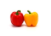Two sweet peppers of yellow and red color on a light background.Natural product. Natural color. Close-up.