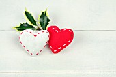 RED AND WHITE FABRIC HEARTS WITH HOLLY
