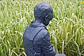 SCULPTURE OF CHILD AT HARLOW CARR GARDEN