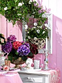 FLOWERY DECORATED BALCONY WITH A CLIMBING ROSE