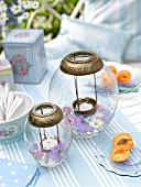 TABLE LANTERNS WITH FLOWERS