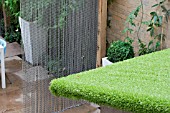 THE DRAWING ROOM GARDEN  URBAN LONDON GARDEN  ASTRO-TURF USED ON SHED ROOF CHAIN SCREEN TO THE REAR.  DESIGNED BY: EARTH DESIGNS.