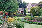 MIXED BORDERS AND OLD COTSWOLD HOUSE AT CAMERS, OLD SODBURY, BRISTOL