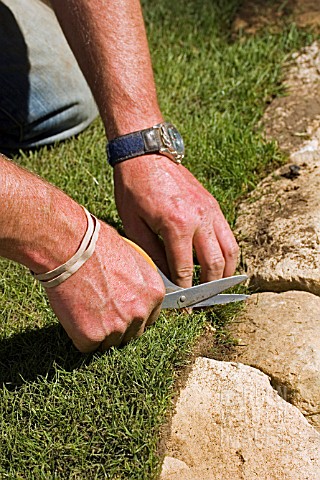 LAYING_TURF__TRIMMING_EDGES_WITH_SCISSORS