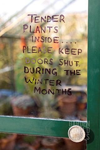 TENDER_PLANTS_SIGN_ON_GREENHOUSE_DOOR