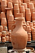 TERRACOTTA AMPHORA AND POTS ON DISPLAY AT A MARKET IN LEBANON