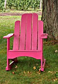 PINK WOODEN CHAIR IN A SHADY SPOT