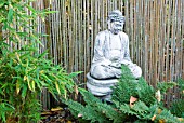 FERNS AND BAMBOO WITH BUDDHA STATUE