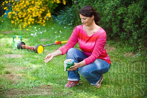 LAWN_ACTION_SPREADING_GRASS_SEED_BY_HAND