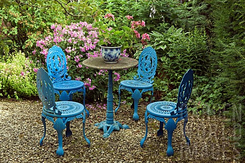 Seating_area_ornate_iron_garden_table_and_chairs_in_blue
