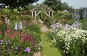 Deep borders of mixed colours and varieties of herbaceous perennials
